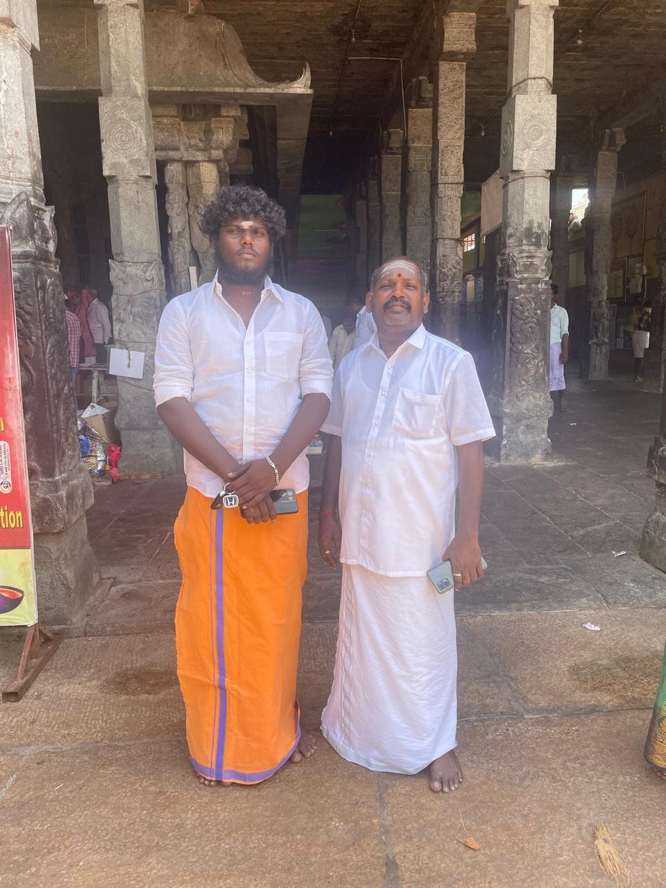 Guruji with a visiting guest at the temple's pillared hall