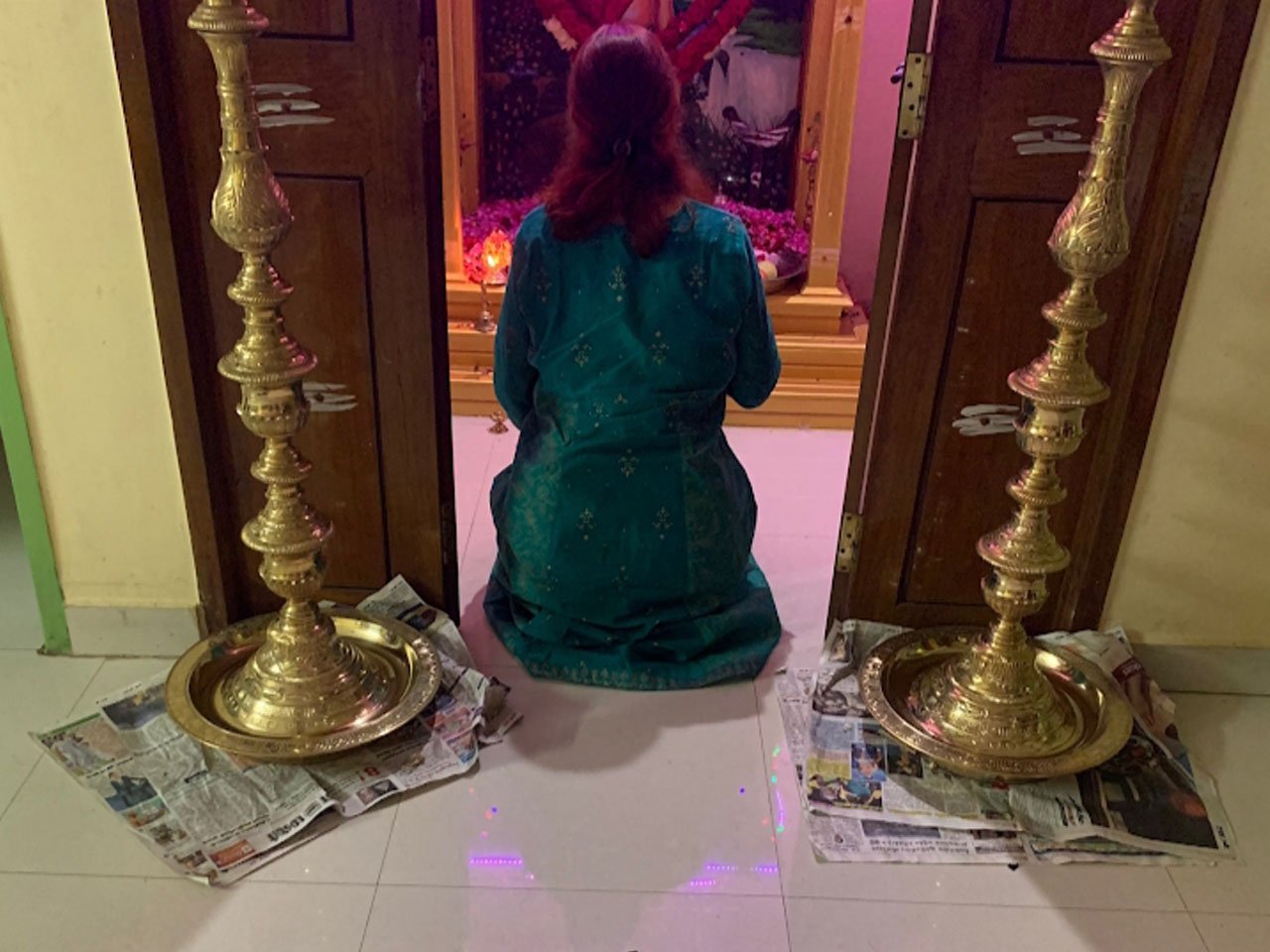 A seeker in prayer at the shrine